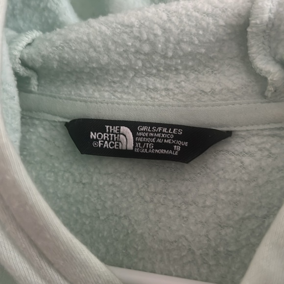 Girls’ The North Face Hoodie in light teal, size XL. - Picture 2 of 2